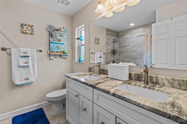 9973 N Chelic Dr, Citrus Springs, FL 34434 - full bath with baseboards, toilet, double vanity, and tiled shower