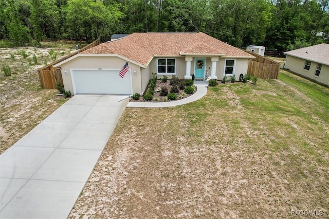 9973 N Chelic Dr, Citrus Springs, FL 34434 - ranch-style home featuring a garage, stucco siding, concrete driveway, and roof with shingles