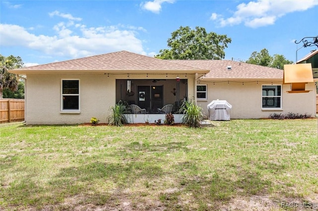 9973 N Chelic Dr, Citrus Springs, FL 34434 - back of house with stucco siding, a sunroom, and a shingled roof