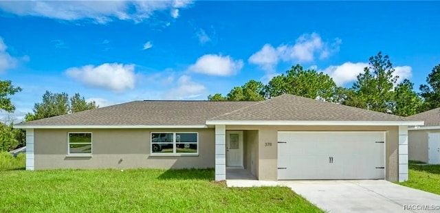 single story home featuring a front lawn and a garage