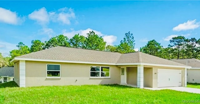 single story home with a front yard and a garage