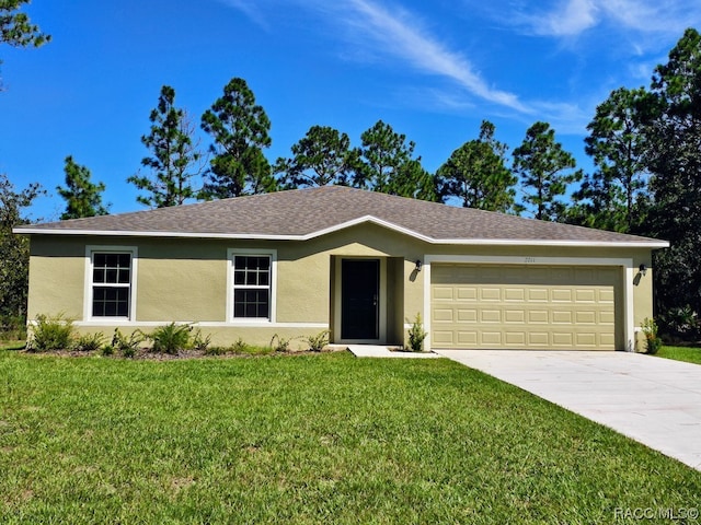 ranch-style home with a front yard and a garage