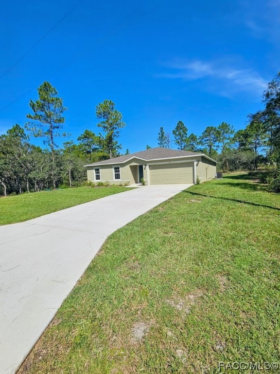 ranch-style home with a garage and a front lawn