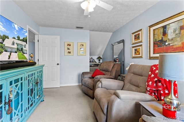 carpeted living room featuring lofted ceiling, ceiling fan, and a textured ceiling