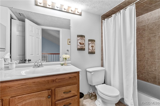 full bathroom featuring shower / tub combo with curtain, vanity, a textured ceiling, and toilet