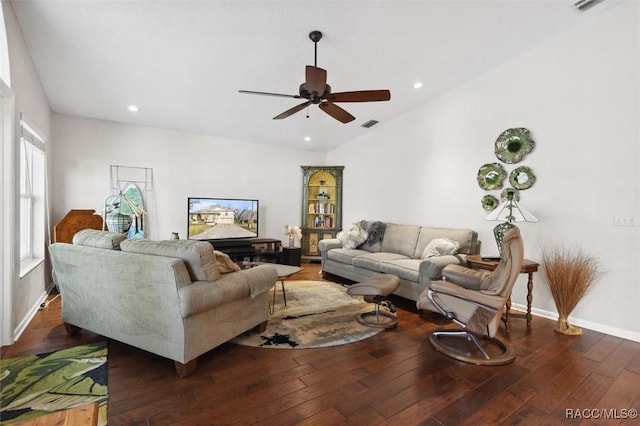 living room featuring dark wood-type flooring and ceiling fan