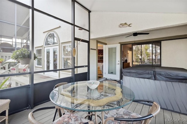 sunroom with a jacuzzi