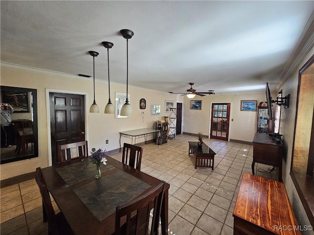 dining area featuring crown molding, light tile patterned floors, and ceiling fan