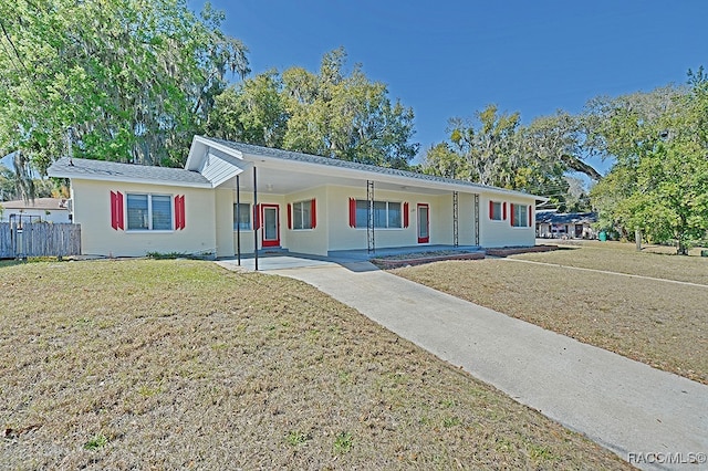 single story home featuring a front yard and covered porch