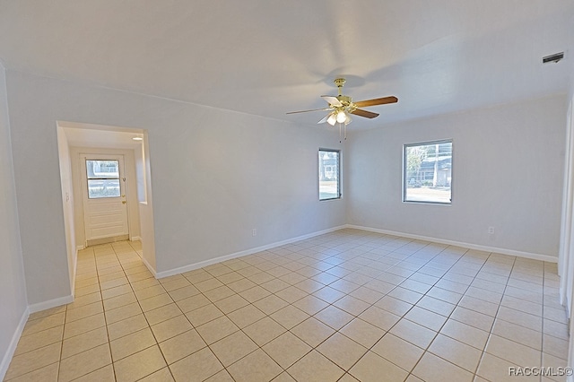 unfurnished room featuring light tile patterned floors and ceiling fan