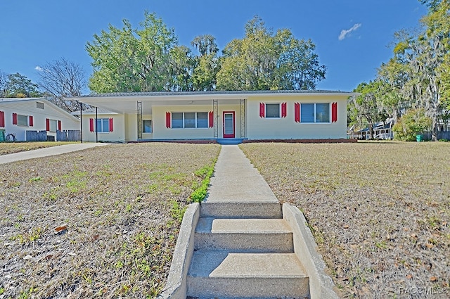 view of front of home featuring a porch and a front yard