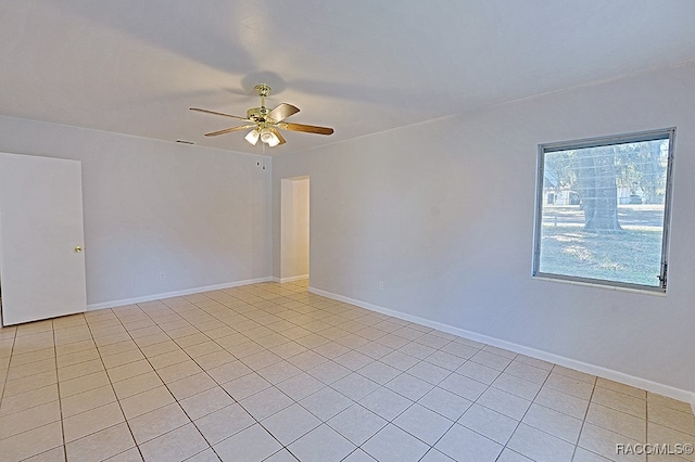 unfurnished room featuring light tile patterned floors and ceiling fan