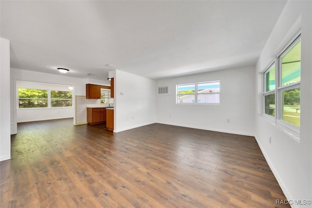 7 N Adams St, Beverly Hills, FL 34465 - unfurnished living room featuring dark wood-style floors and baseboards