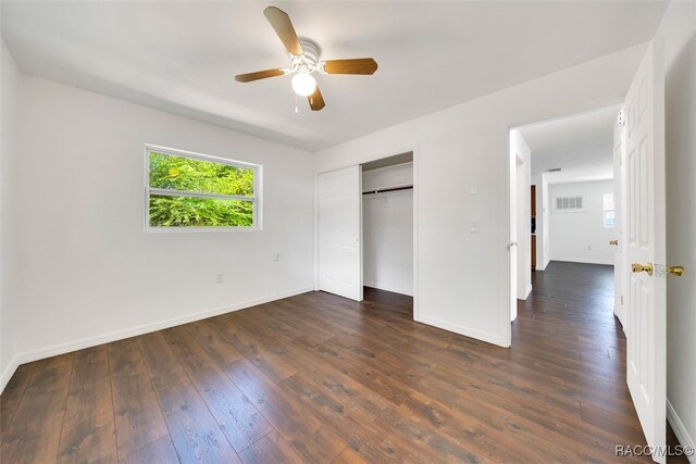 7 N Adams St, Beverly Hills, FL 34465 - unfurnished bedroom with dark wood-style flooring, a closet, and ceiling fan
