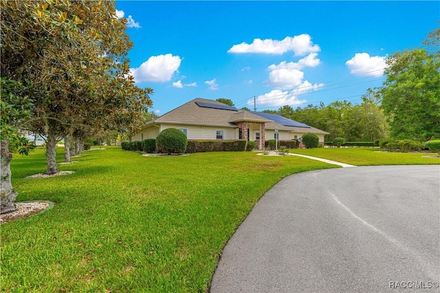 1200 N Annapolis Ave, Hernando, FL 34442 - view of front of home with solar panels and a front lawn