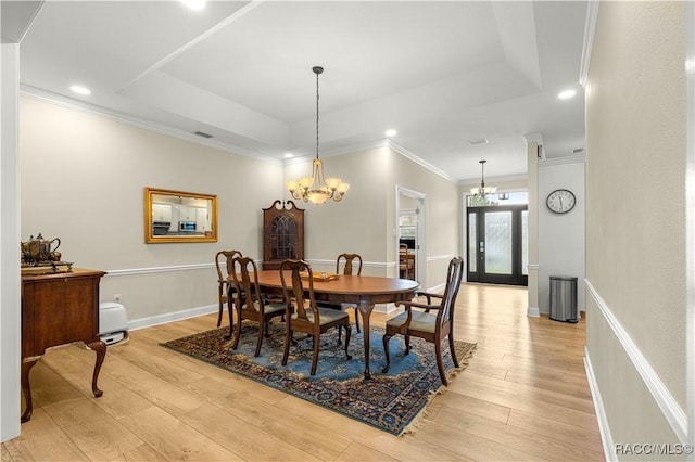 1200 N Annapolis Ave, Hernando, FL 34442 - dining space with a chandelier, light wood-style floors, a tray ceiling, recessed lighting, and crown molding