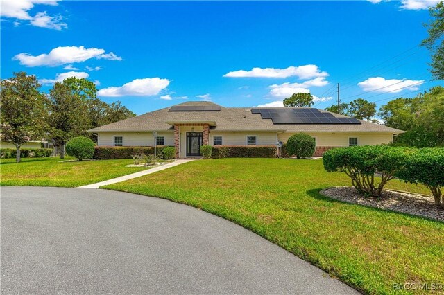 1200 N Annapolis Ave, Hernando, FL 34442 - single story home featuring a front lawn and solar panels
