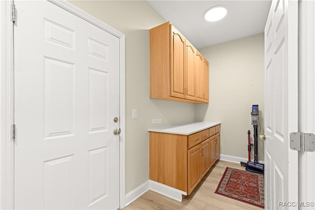 1200 N Annapolis Ave, Hernando, FL 34442 - laundry area with light wood-style flooring and baseboards