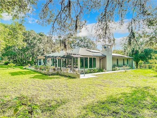 back of house with a yard