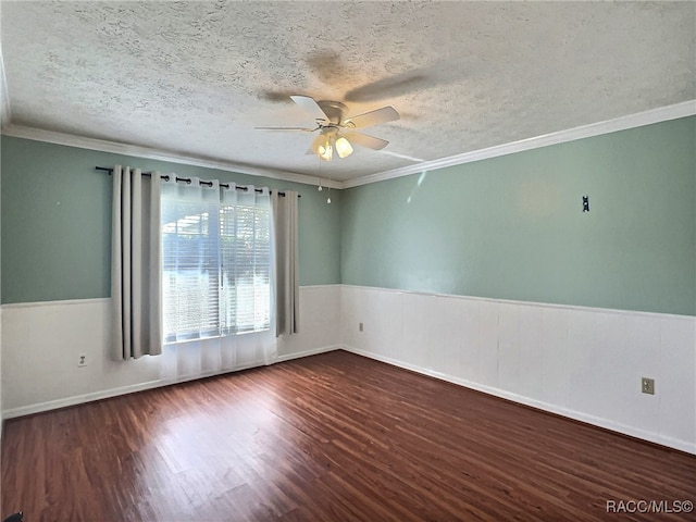 unfurnished room featuring dark hardwood / wood-style floors, ceiling fan, ornamental molding, and a textured ceiling