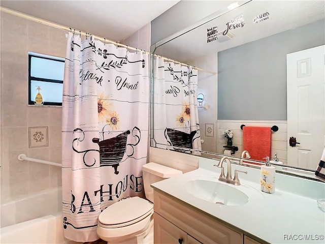 full bathroom featuring shower / bath combo, vanity, toilet, and tile walls