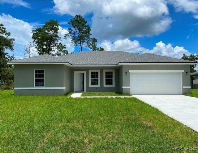 ranch-style home with a garage and a front yard