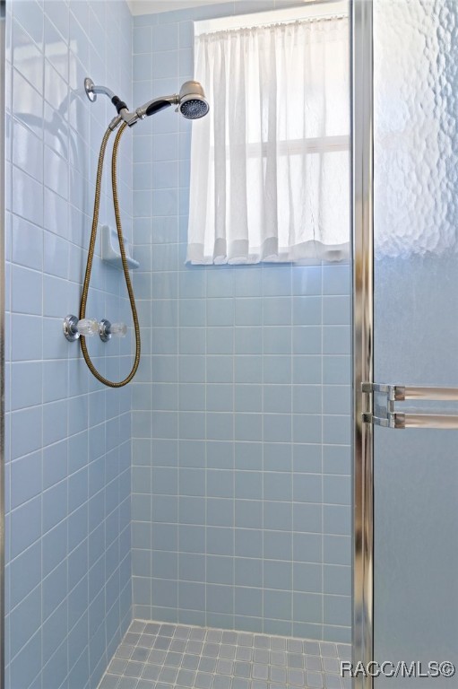 bathroom with a stall shower