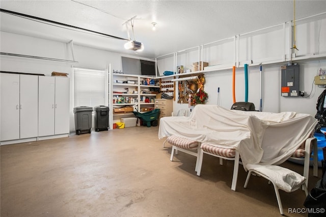 garage featuring a garage door opener and electric panel