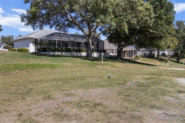 view of yard with glass enclosure