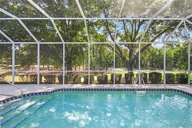outdoor pool featuring a lanai