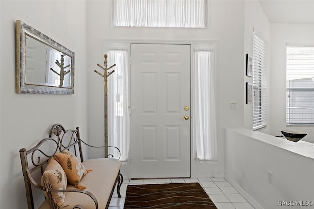 entrance foyer with light tile patterned flooring