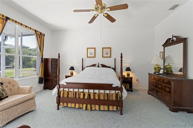 carpeted bedroom with baseboards, ceiling fan, and visible vents