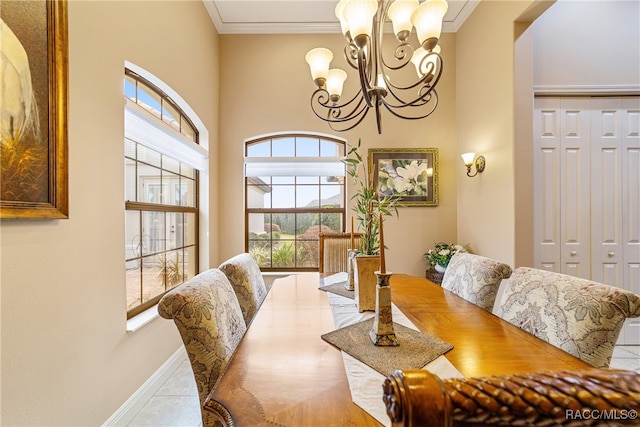 dining space with crown molding and an inviting chandelier