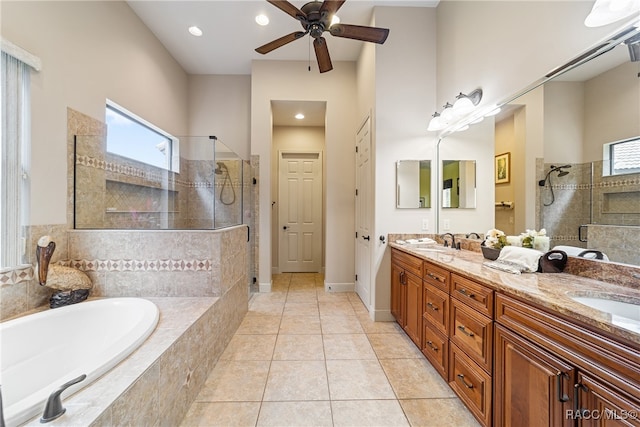 bathroom with tile patterned floors, a wealth of natural light, and plus walk in shower