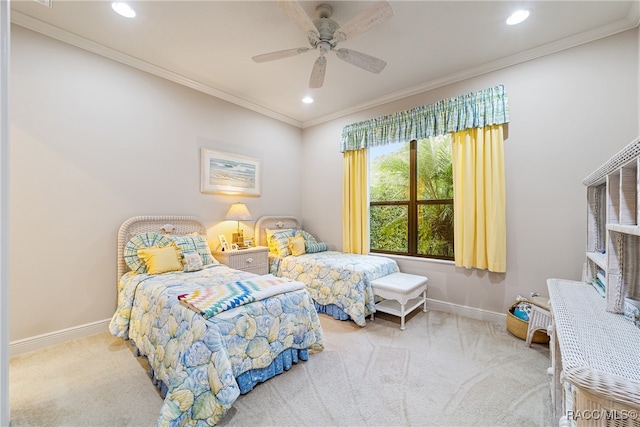 carpeted bedroom featuring ceiling fan and ornamental molding