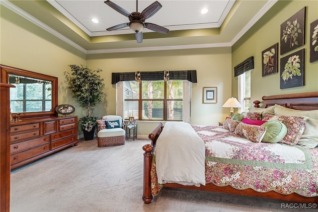 bedroom with ceiling fan, ornamental molding, carpet floors, and multiple windows