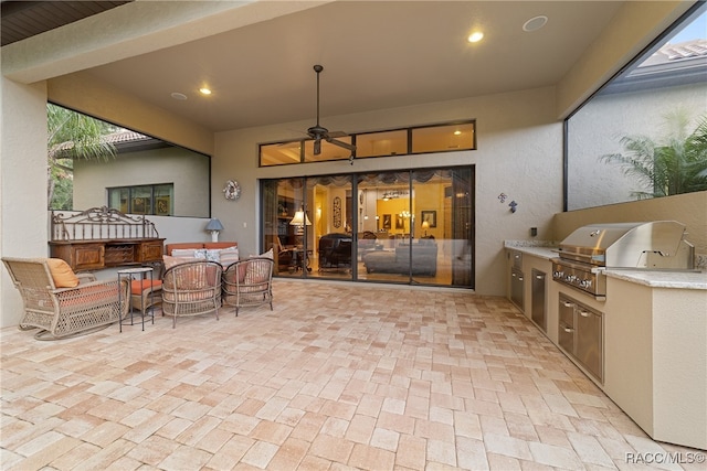 view of patio / terrace with area for grilling, grilling area, and ceiling fan