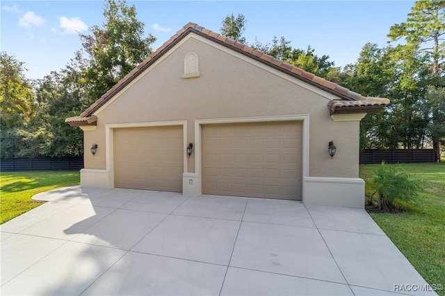 garage with a lawn