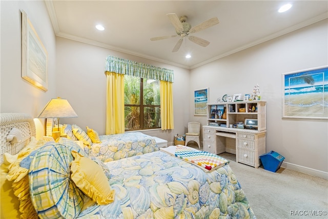 carpeted bedroom featuring ceiling fan and ornamental molding