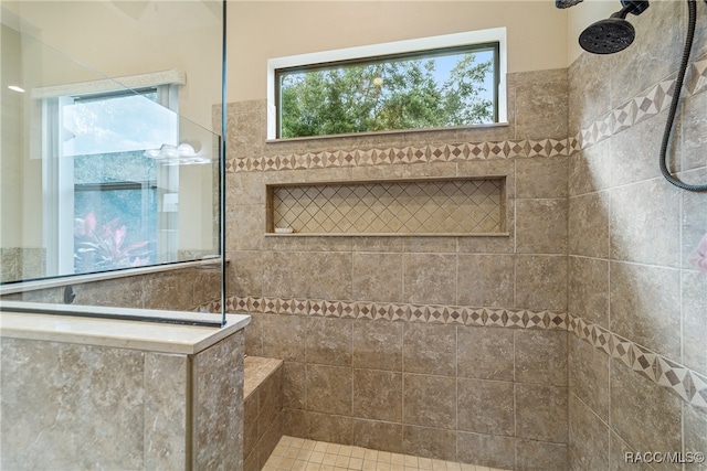 bathroom featuring a tile shower