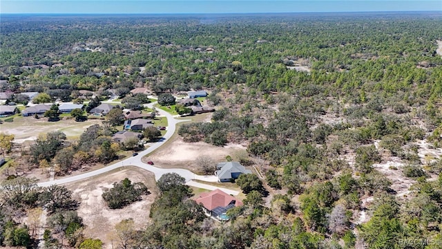 aerial view featuring a wooded view