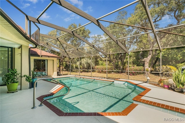 outdoor pool featuring a patio and a lanai