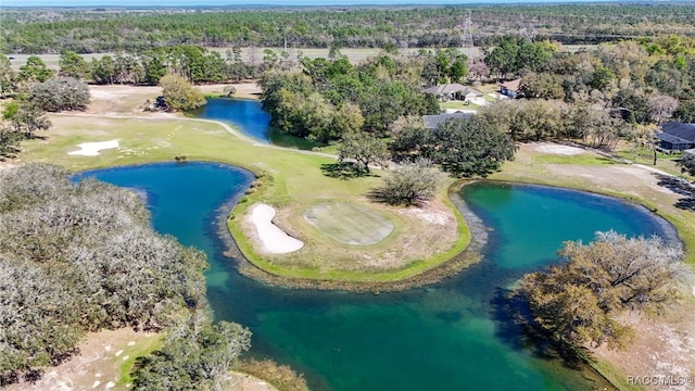 birds eye view of property featuring golf course view and a water view