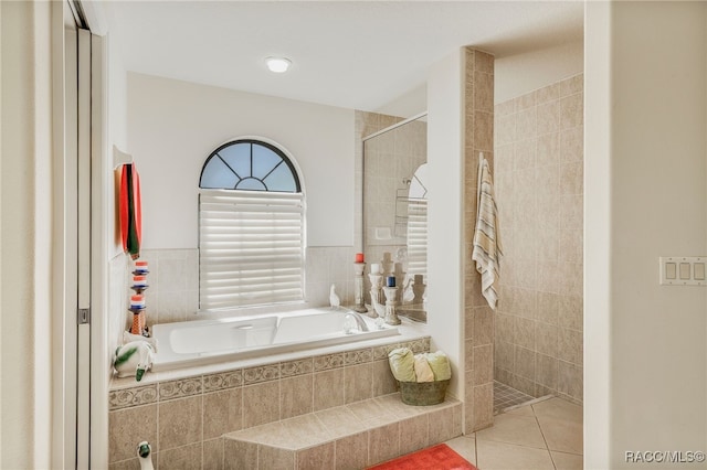 full bathroom with tile patterned floors, walk in shower, and a bath