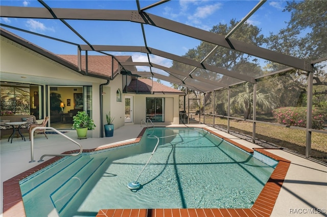 pool featuring a lanai and a patio