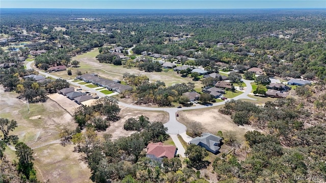 birds eye view of property with a residential view and a view of trees