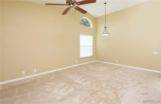 spare room with ceiling fan, high vaulted ceiling, and carpet floors