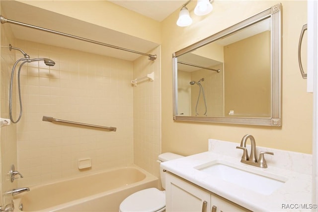 full bathroom with tiled shower / bath combo, vanity, and toilet