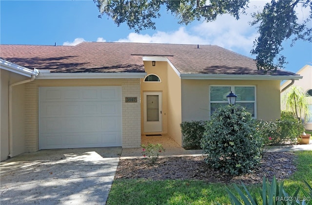 ranch-style home with a garage