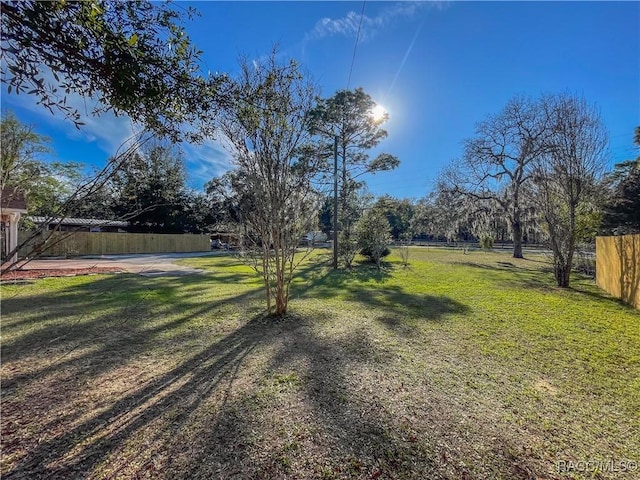 view of yard featuring fence